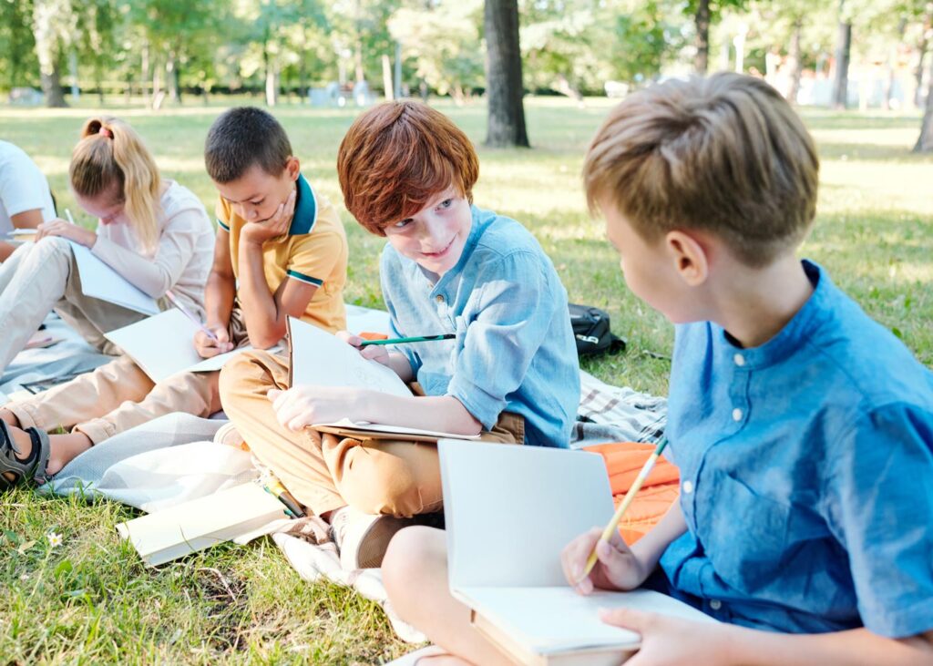 Young students working together on their school work